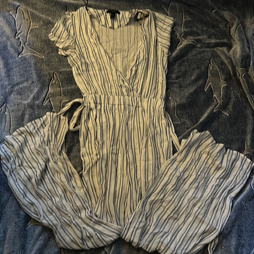 Blue and white vertical stripes jumpsuit.